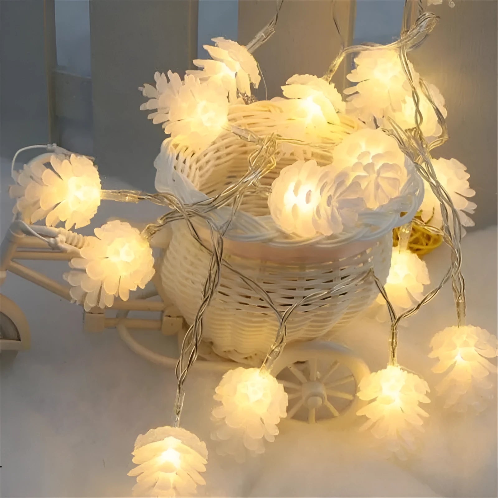 Warm white battery-operated LED pine cone string lights for decoration, showing plastic shell design.