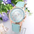 Retro GENEVA quartz watch with three-eye chronograph and brown leather belt on wrist