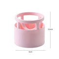 Pink plastic beauty egg stand storage rack for cosmetics on a bedroom shelf