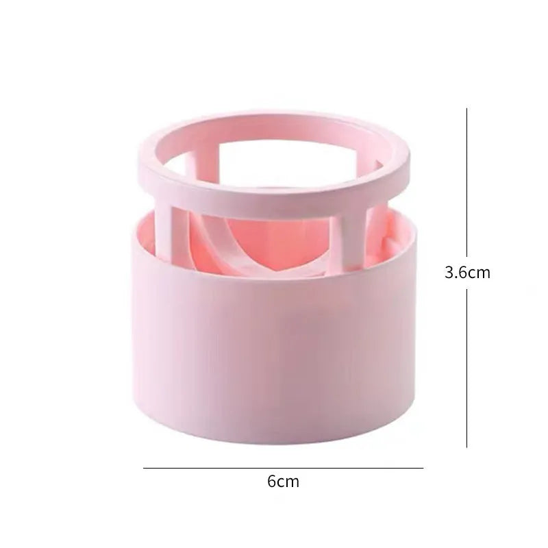Pink plastic beauty egg stand storage rack for cosmetics on a bedroom shelf