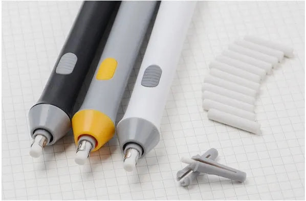 Black electric eraser with plastic body and geometric design on a white background