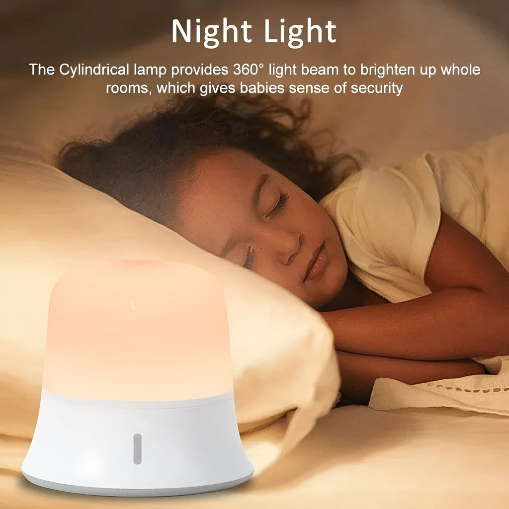 White touch control bedside night light with rechargeable battery and motion sensor on a table.