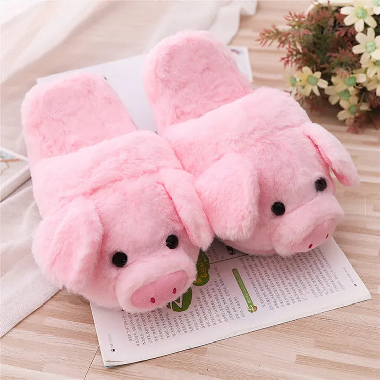 Pink pig-shaped plush floor slippers with PP cotton filling on a plain background