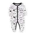 Cotton baby one-piece romper in a dinosaur print style for infants, showing size options from 3 to 12 months.