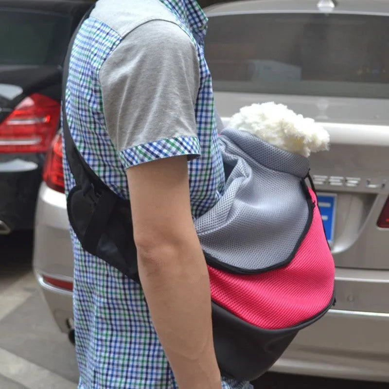 Blue pet backpack carrier for a small cat, showing padded interior and adjustable straps.