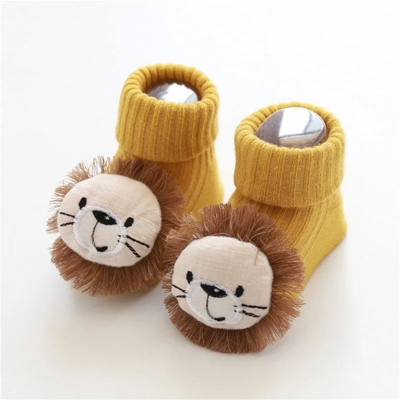 Cotton baby floor socks in various colours and patterns including pink bows, grey stars, and panda design.