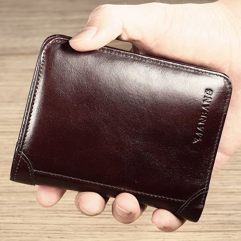 Men's black full-grain leather bifold wallet open, showing card slots, note pocket, and zipped coin compartment.