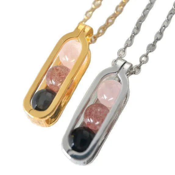 Minority simple pearl necklace with gold titanium steel chain and inlaid pearl pendant on plain background