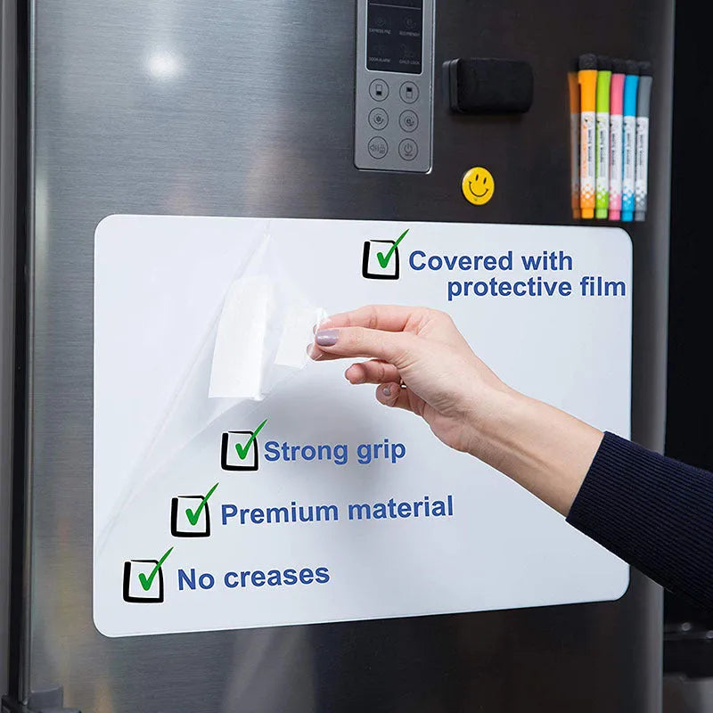 A3 magnetic soft whiteboard as rounded fridge magnet on a refrigerator door showing written notes