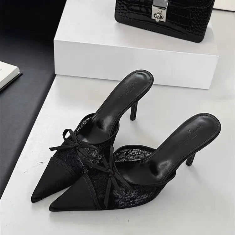 Women's light brown high heels with a pointed toe, decorative bowknot, and mesh upper.