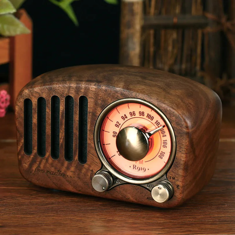 Retro wooden mini Bluetooth speaker in cherry or walnut finish showing compact size