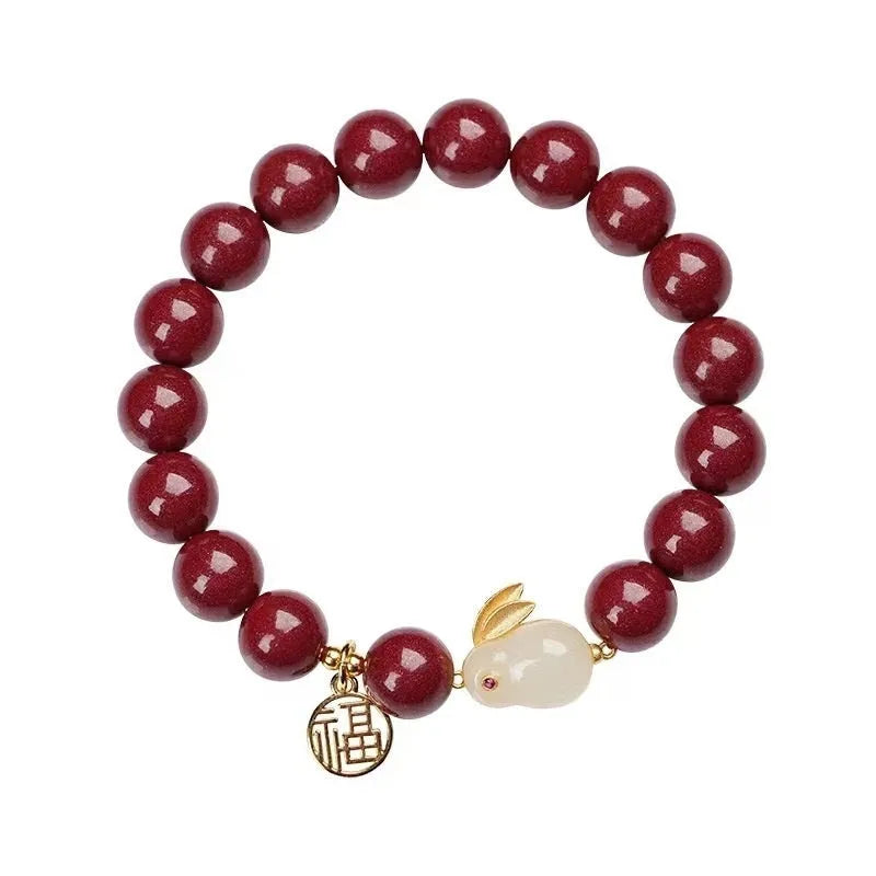 Purple gold sand cinnabar bracelet with jade hare charm in 6mm and 8mm bead sizes