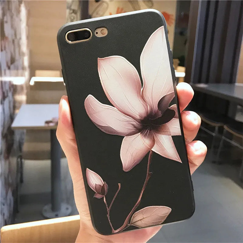 Embossed iPhone case with flower design in black TPU material showing textured back surface