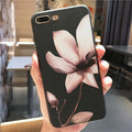 Embossed iPhone case with flower design in black TPU material showing textured back surface