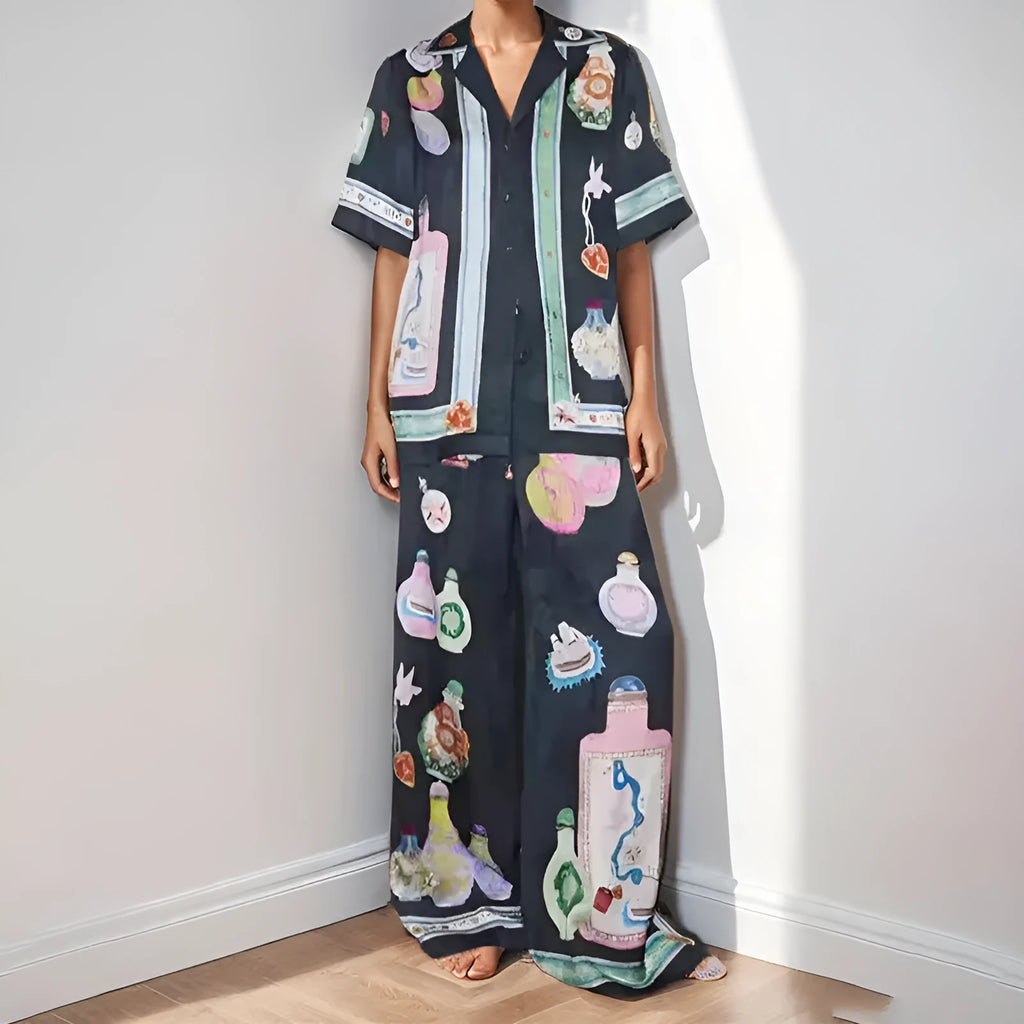 Black women's casual set with cartoon print, featuring a cardigan and matching trousers