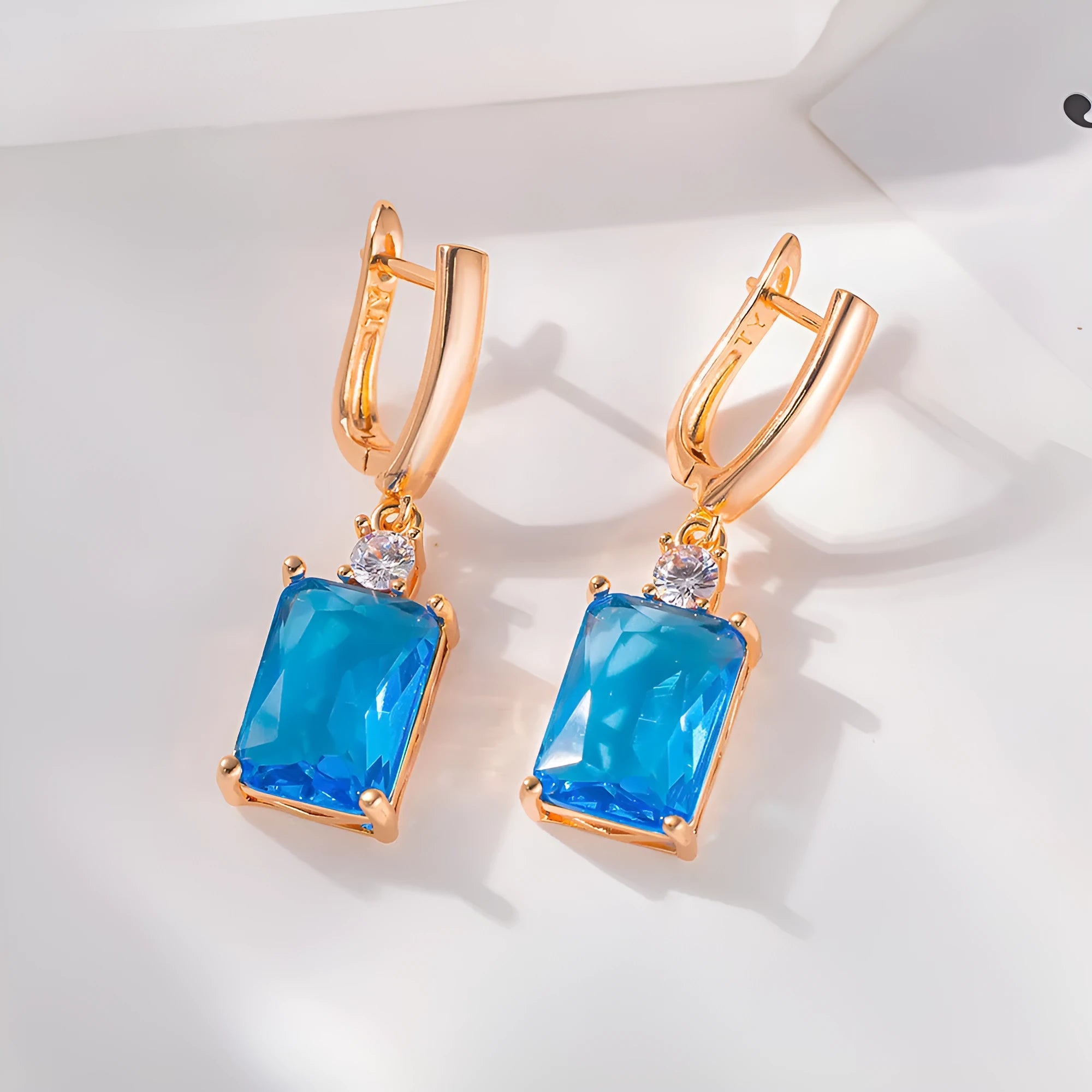 Square quadrilateral geometry earrings with electroplated gold or silver finish on copper construction