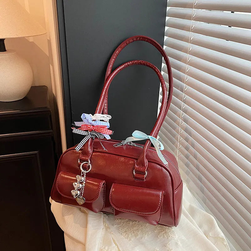 Retro pillow-shaped women's handbag in PU leather with double shoulder straps and flap closure