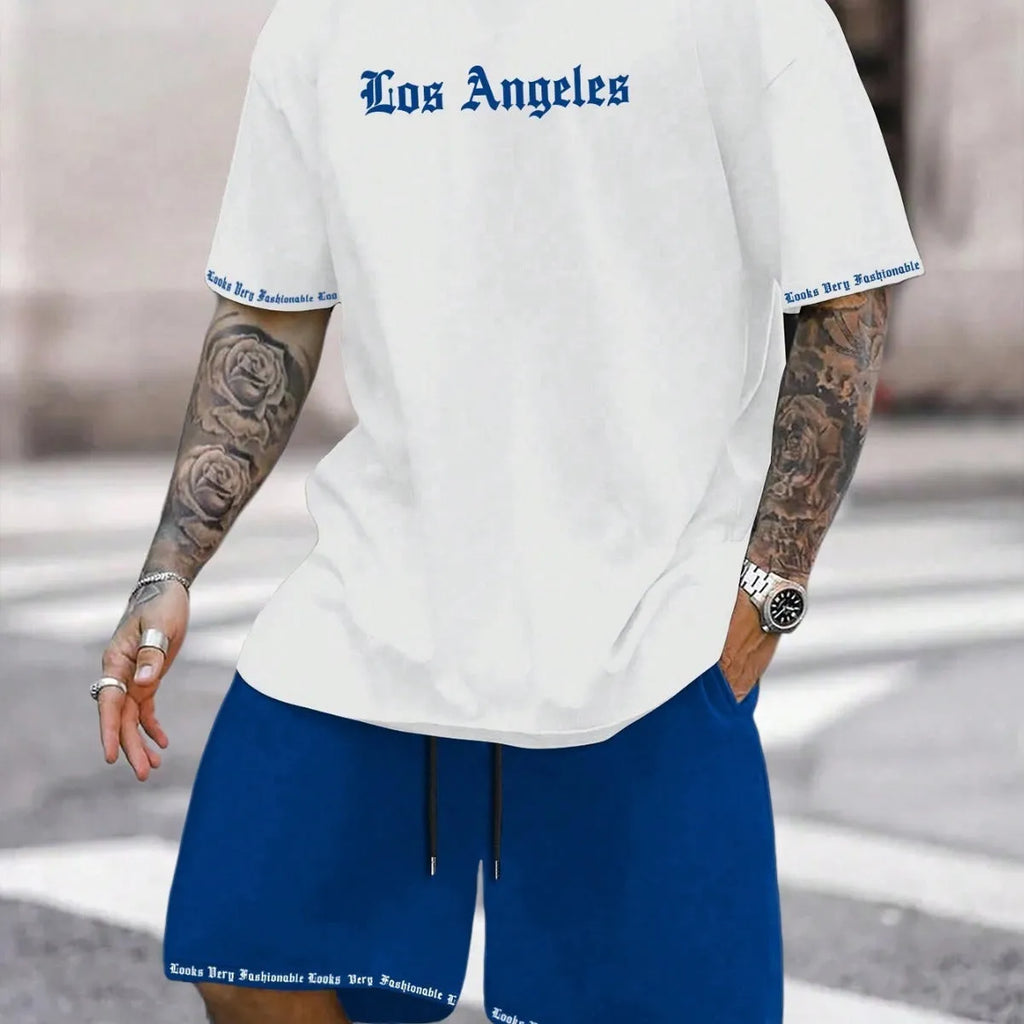 Man wearing a grey short-sleeved sports top and matching shorts from a quick-dry two-piece set.