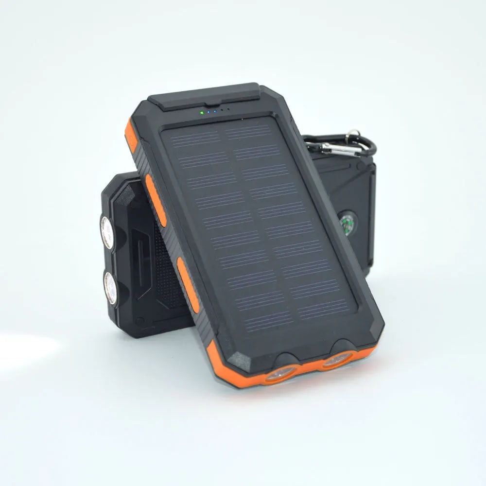 Black solar power bank with compass, LED flashlight, and 20000mAh capacity for mobile phone charging.