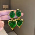 Silver needle pleated oval love heart stud earrings in purple, red, green, and yellow white colour options.
