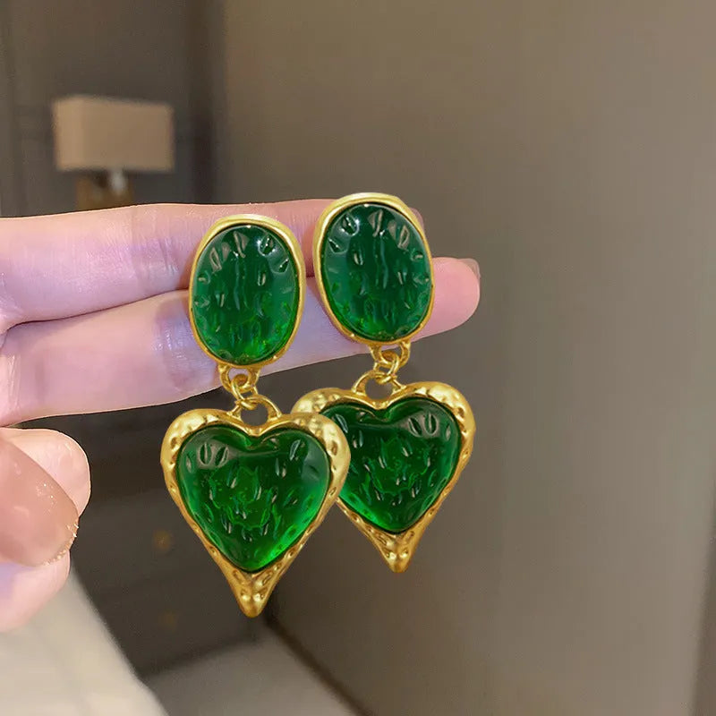 Silver needle pleated oval love heart stud earrings in purple, red, green, and yellow white colour options.