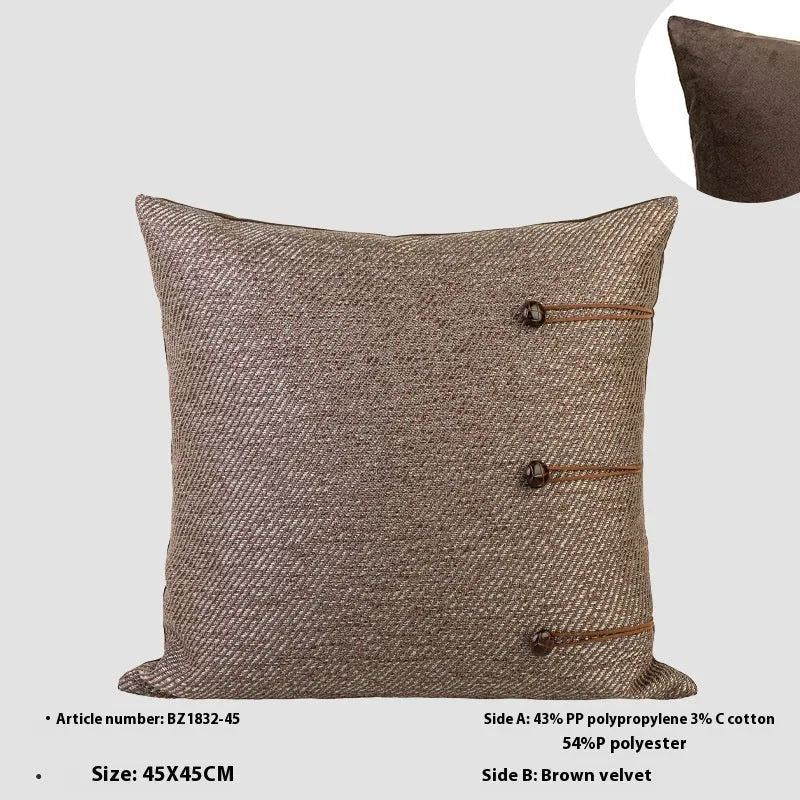 Chinese style square cushion in brown Maillard colour on a sofa.