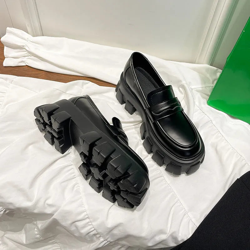British style wide fit loafers in patent leather and matte finishes on a muffin base rubber sole.