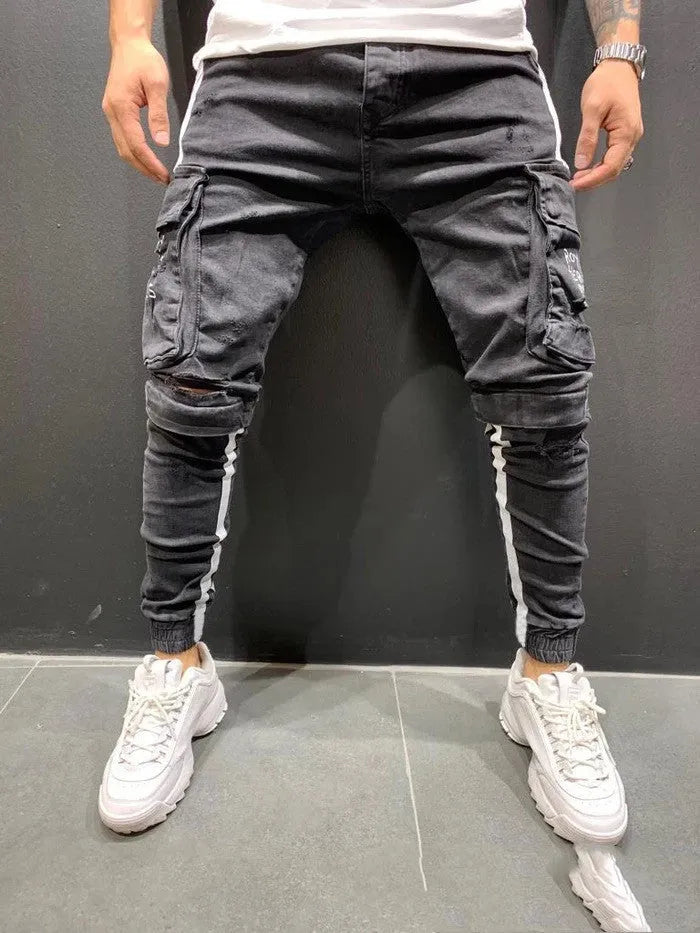 Men's knee-cut denim trousers with zip fly placket, 80% cotton, black or light blue, sizes S to 3XL.