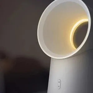 White desktop bladeless fan with USB humidification, 3 speed settings, and LED light on a desk