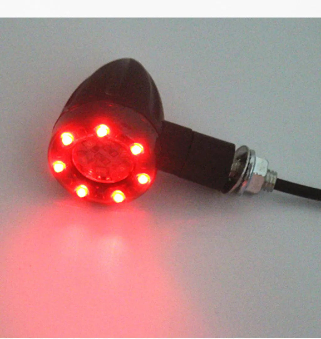 Pair of 6-LED motorcycle turn signals with smoke cover and black plastic housing, 8mm screw mount