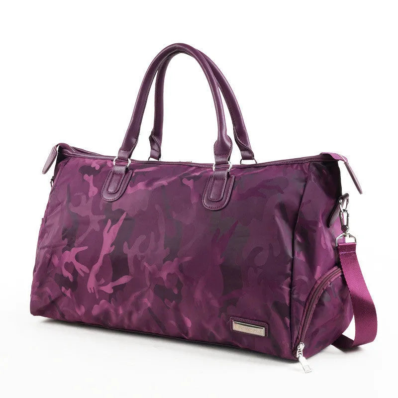 Nylon travel bag in black with soft handle, top zipper, and multiple internal pockets