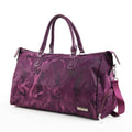 Nylon travel bag in black with soft handle, top zipper, and multiple internal pockets