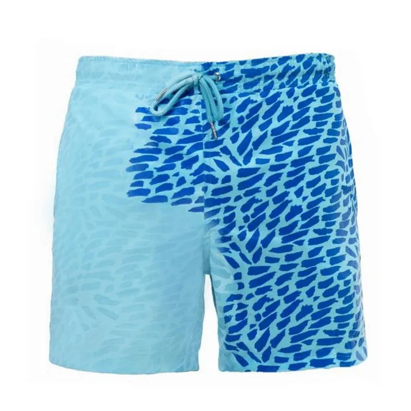 Thermochromic children's polyester shorts in solid blue colour changing to green when warm