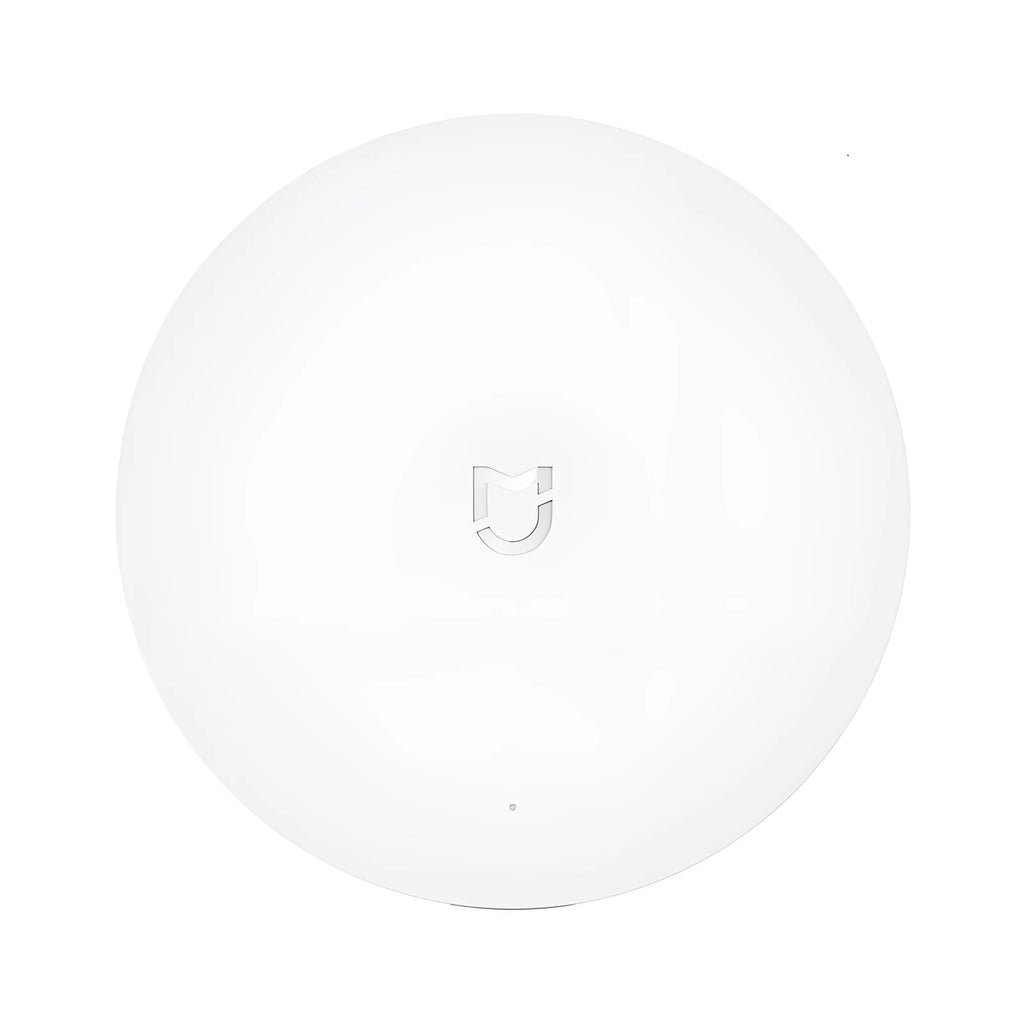 White circular smart home gateway wall switch with UK plug for remote device control