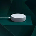 White circular smart home gateway wall switch with UK plug for remote device control