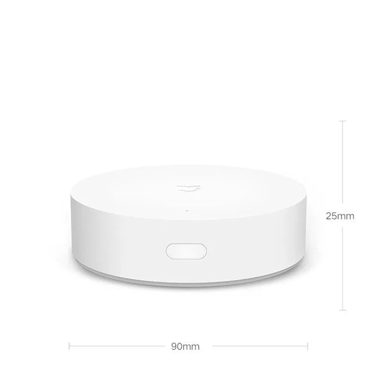 White circular smart home gateway wall switch with UK plug for remote device control