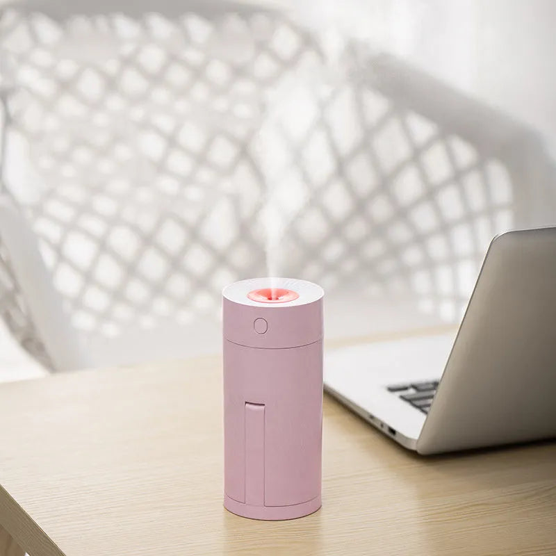 White USB desktop humidifier with folding bracket extended, showing compact 70x70mm base and 156mm height