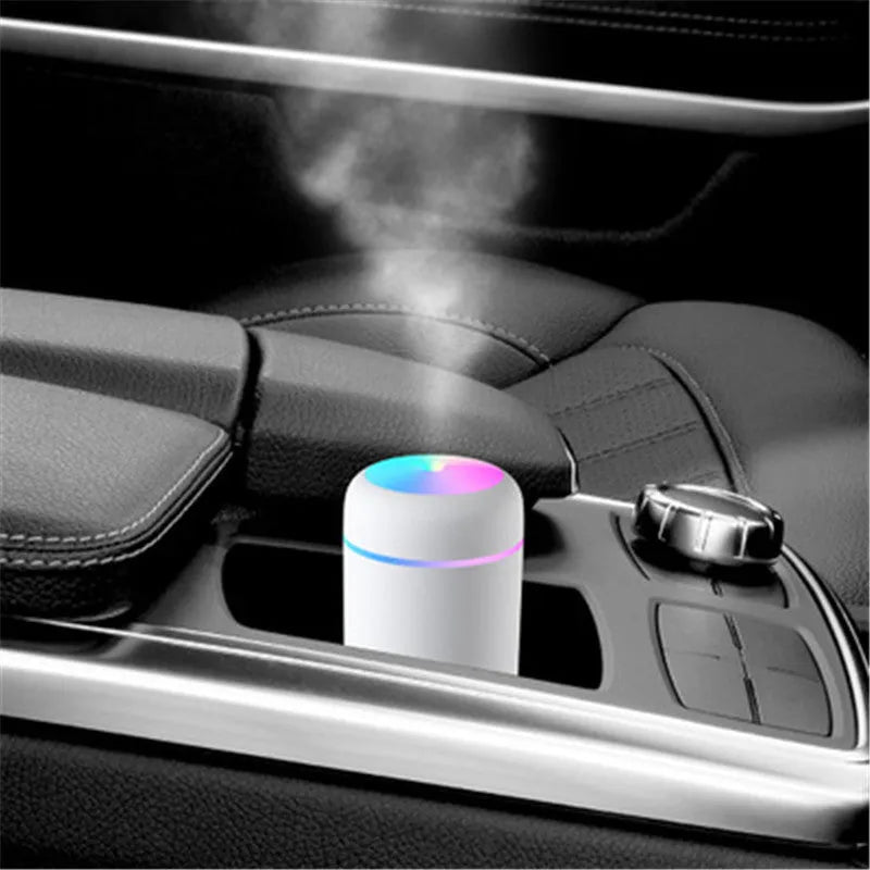 Pink, white or navy blue car humidifier with USB cable, water tank, and colourful LED lights