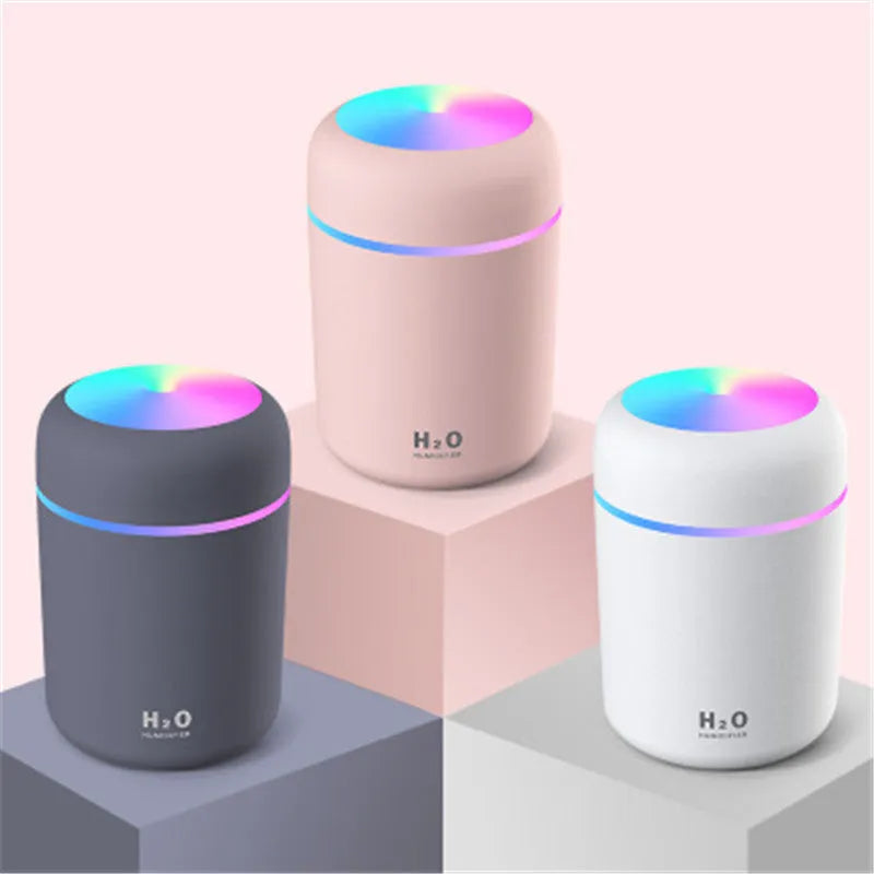 Pink, white or navy blue car humidifier with USB cable, water tank, and colourful LED lights