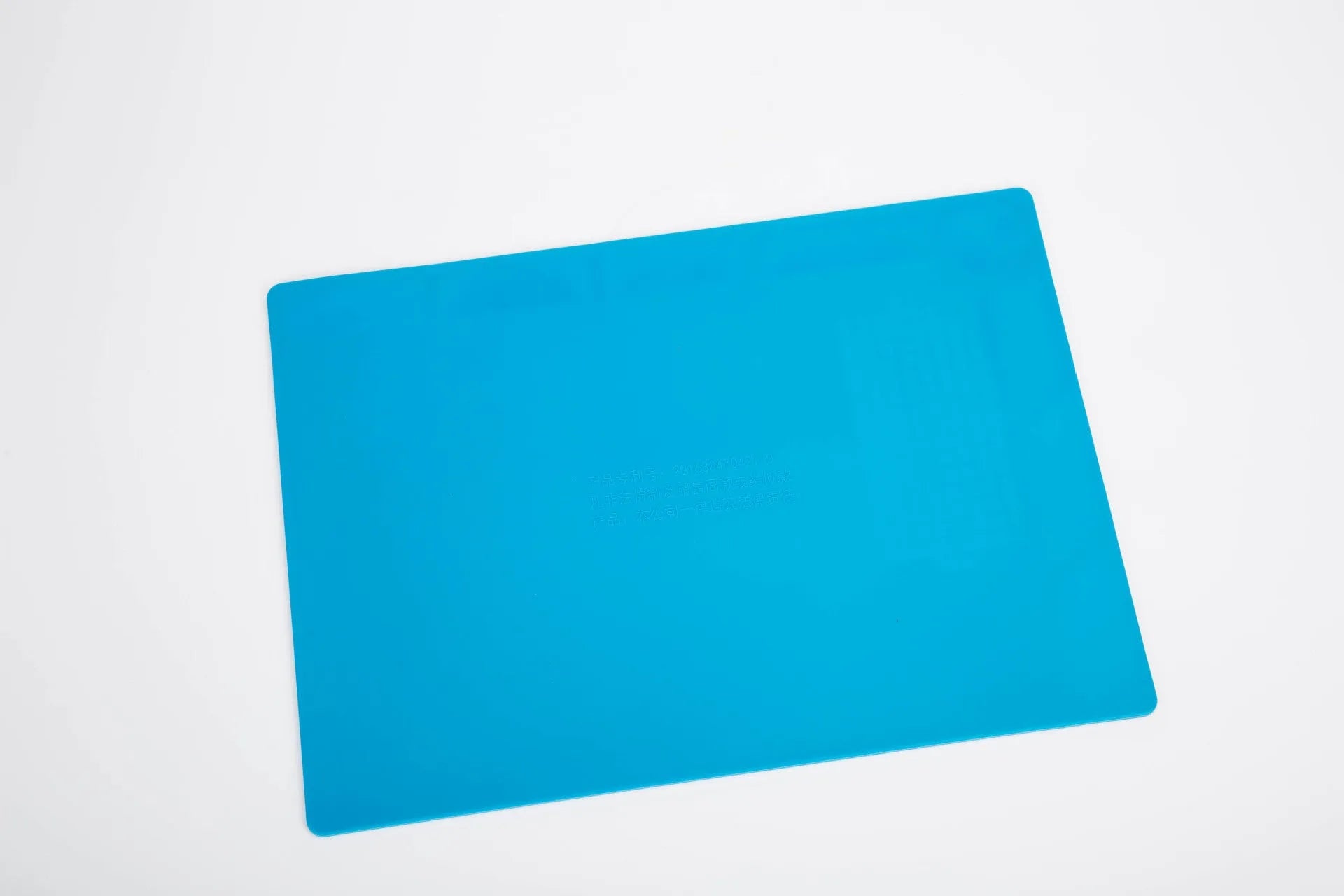Blue silicone watch repair table mat on workbench for non-slip timepiece servicing