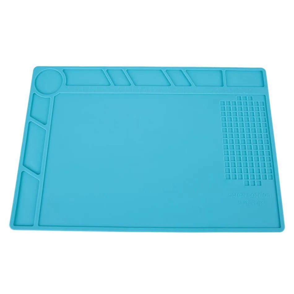 Blue silicone watch repair table mat on workbench for non-slip timepiece servicing