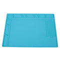 Blue silicone watch repair table mat on workbench for non-slip timepiece servicing