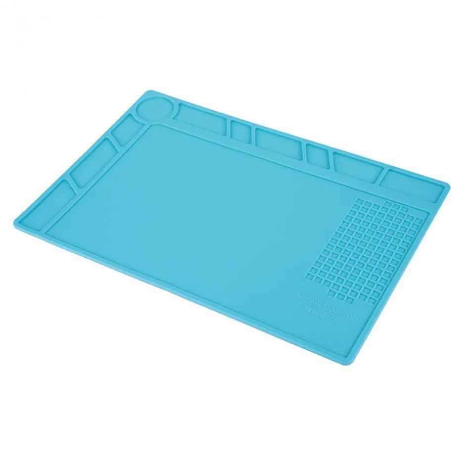 Blue silicone watch repair table mat on workbench for non-slip timepiece servicing