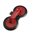 Black and red round burger press with non-stick surface and oil paper liners.