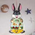 Easter DIY felt bunny pendant with detachable egg patches and letters on a light pink background