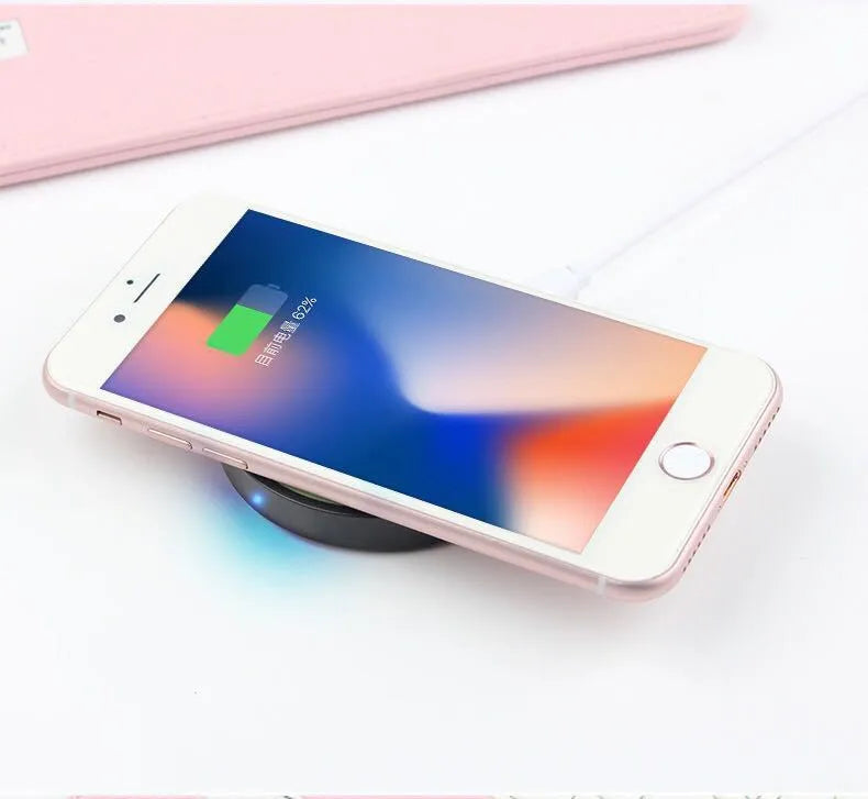 Compact square wireless charging pad in one of six colours: black, blue, orange, red, white, or yellow.