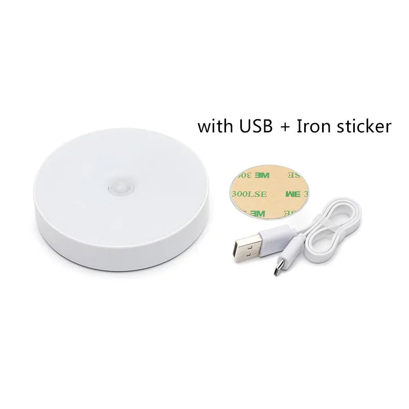 Small round white USB rechargeable motion sensor LED night light with 3M adhesive tape.