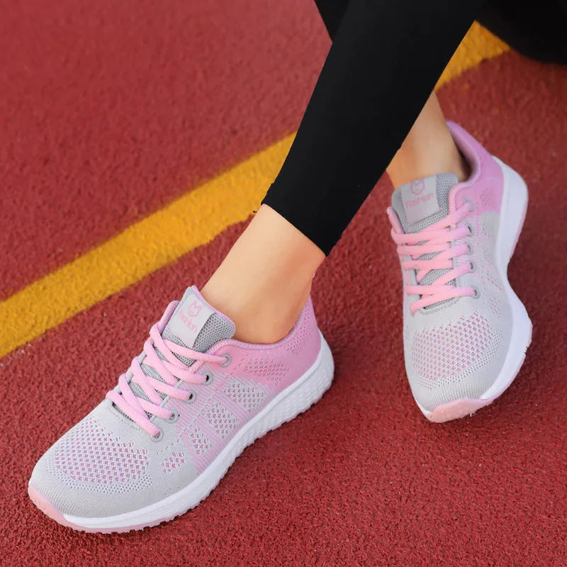 Women's white high top casual shoes with mesh-like net top design and cross bind strap detail.
