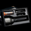 Black aluminium rechargeable flashlight showing scale with 2000 lumen output and type-C charging port
