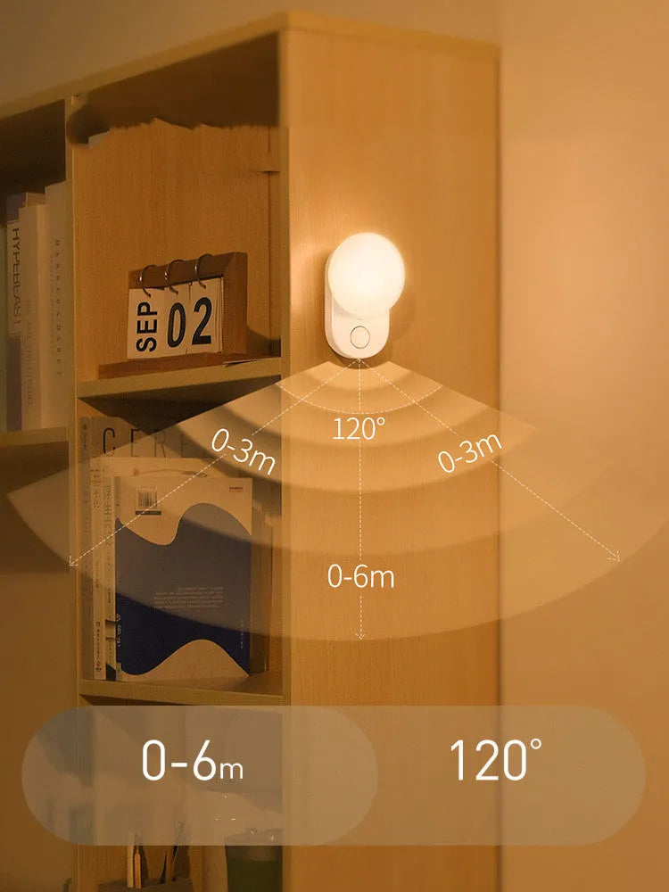 White Baseus rechargeable motion sensor bedside night light with warm LED glow.